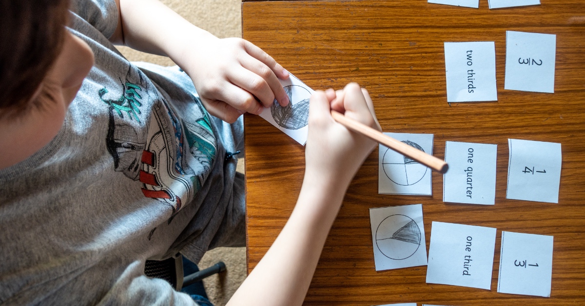 A young student working on fractions.