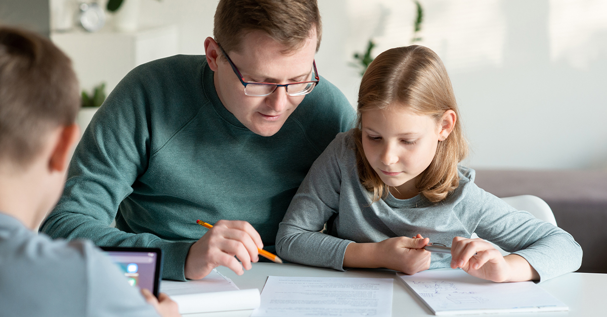 A parent and child doing math together.