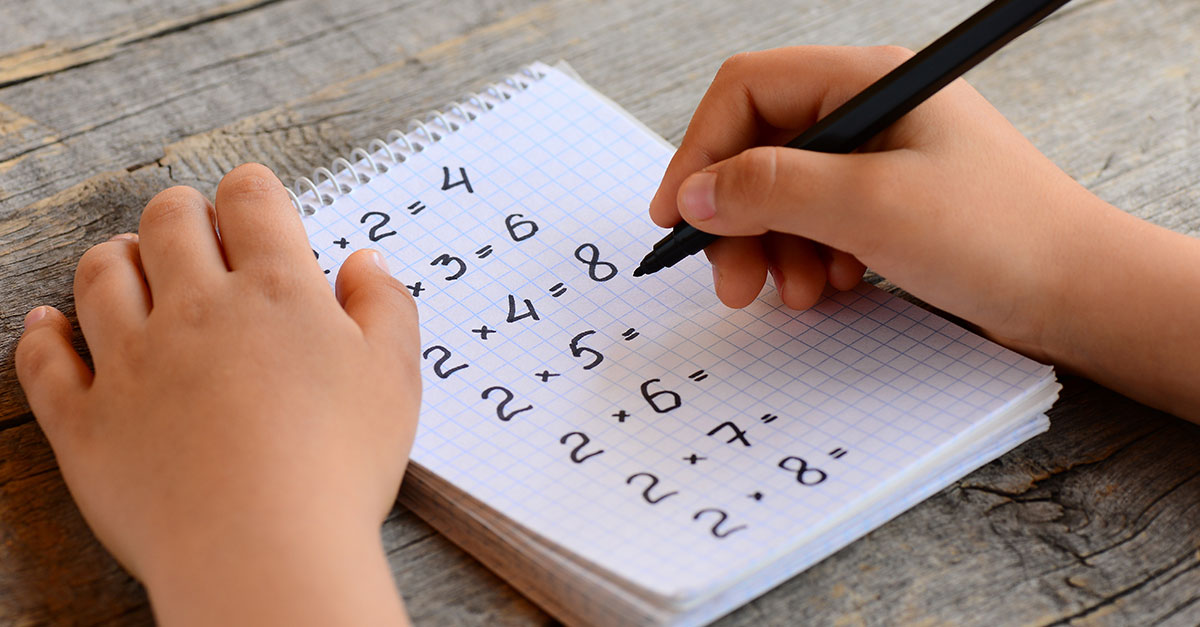 A young student doing multiplication facts.